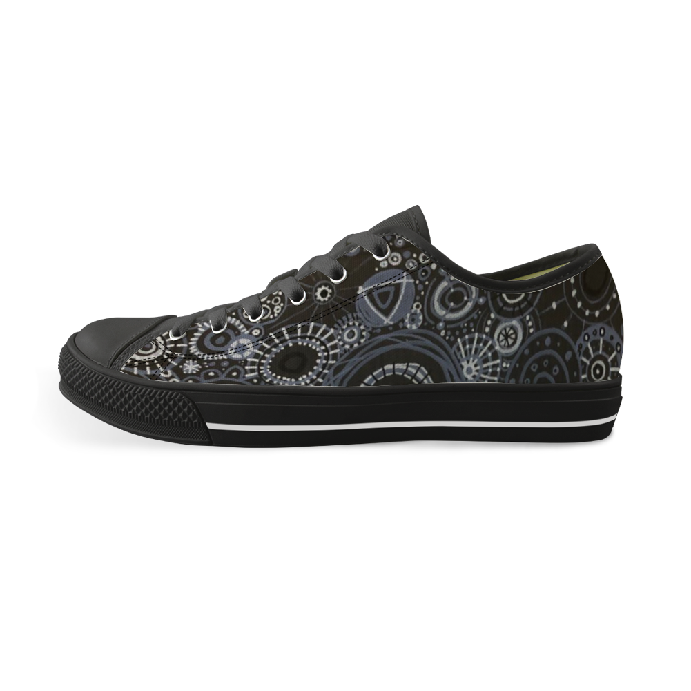 Sneakers with black features and all over pattern in greys and blacks.