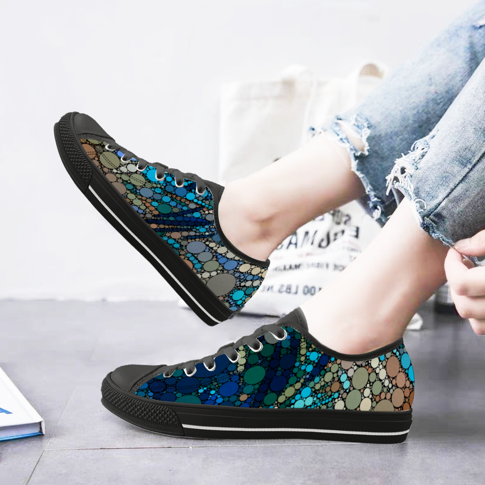 Sneakers with a dot pattern inspired by Vincent Van Gogh on model