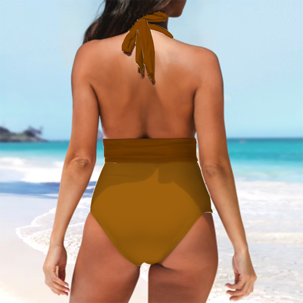 a woman in a brown swimsuit standing on a beach