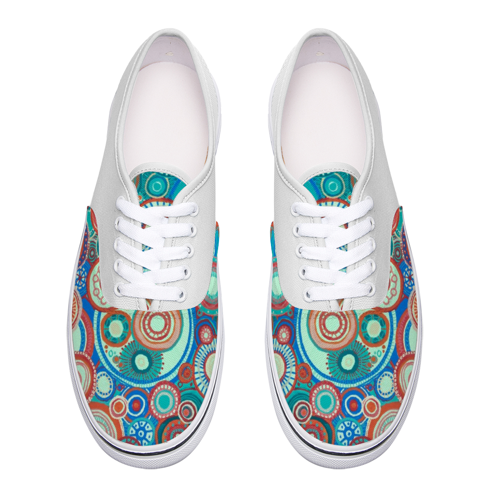 Top Sneakers with green and orange celebration tones with a white back and painted tongue