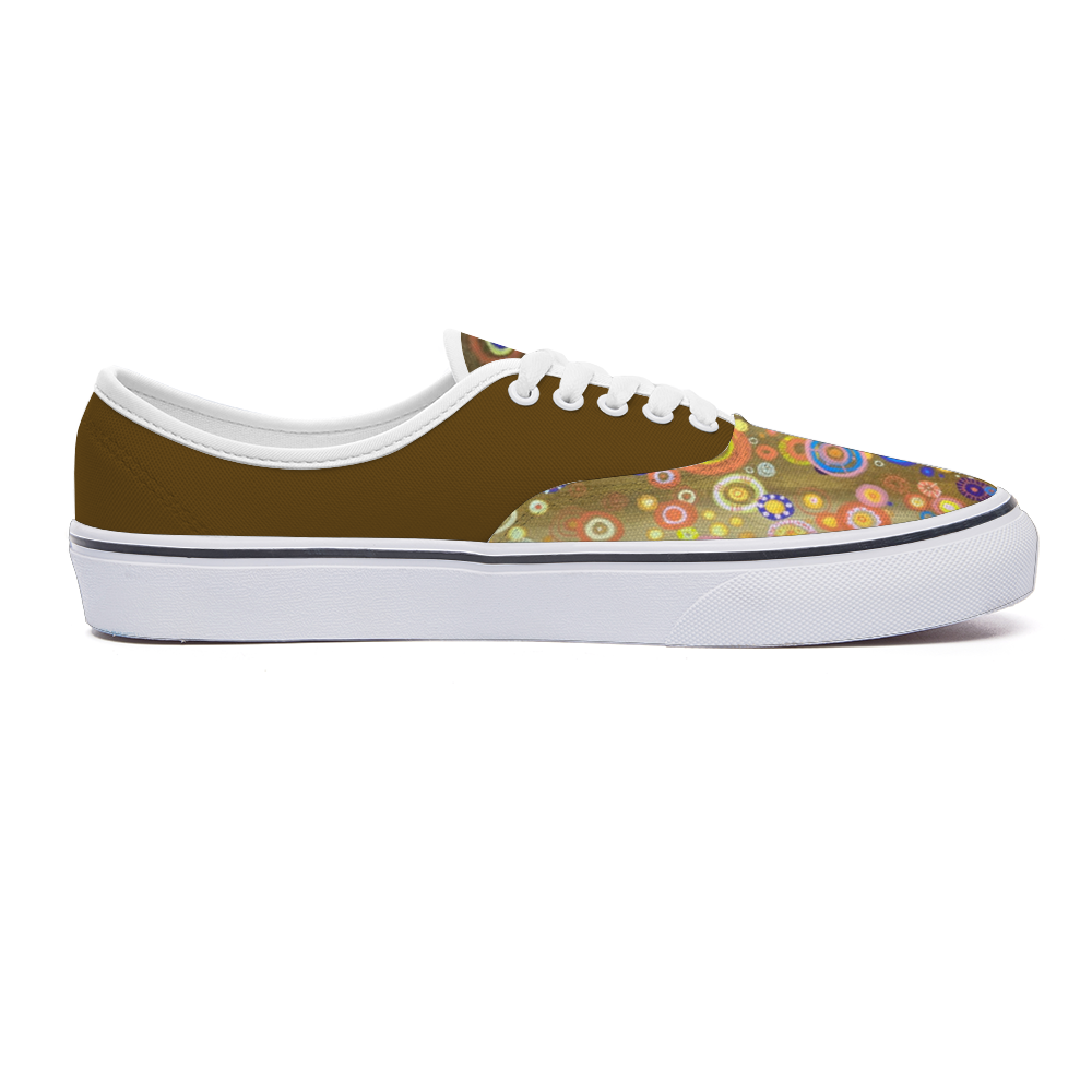 Sneakers with bright intricately coloured front and mustard dull back