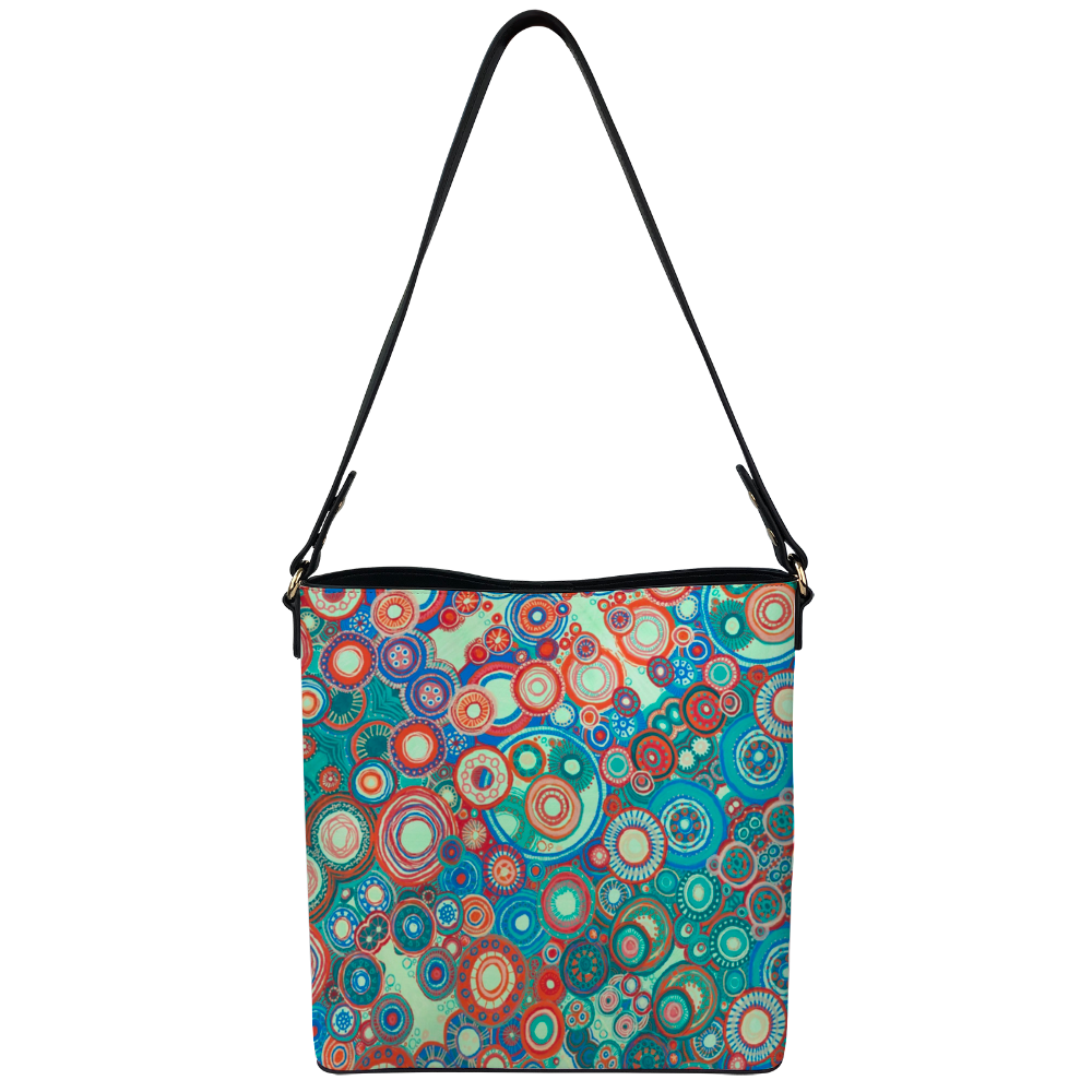 Shoulder bag with intricate and contrasting orange green colour scheme