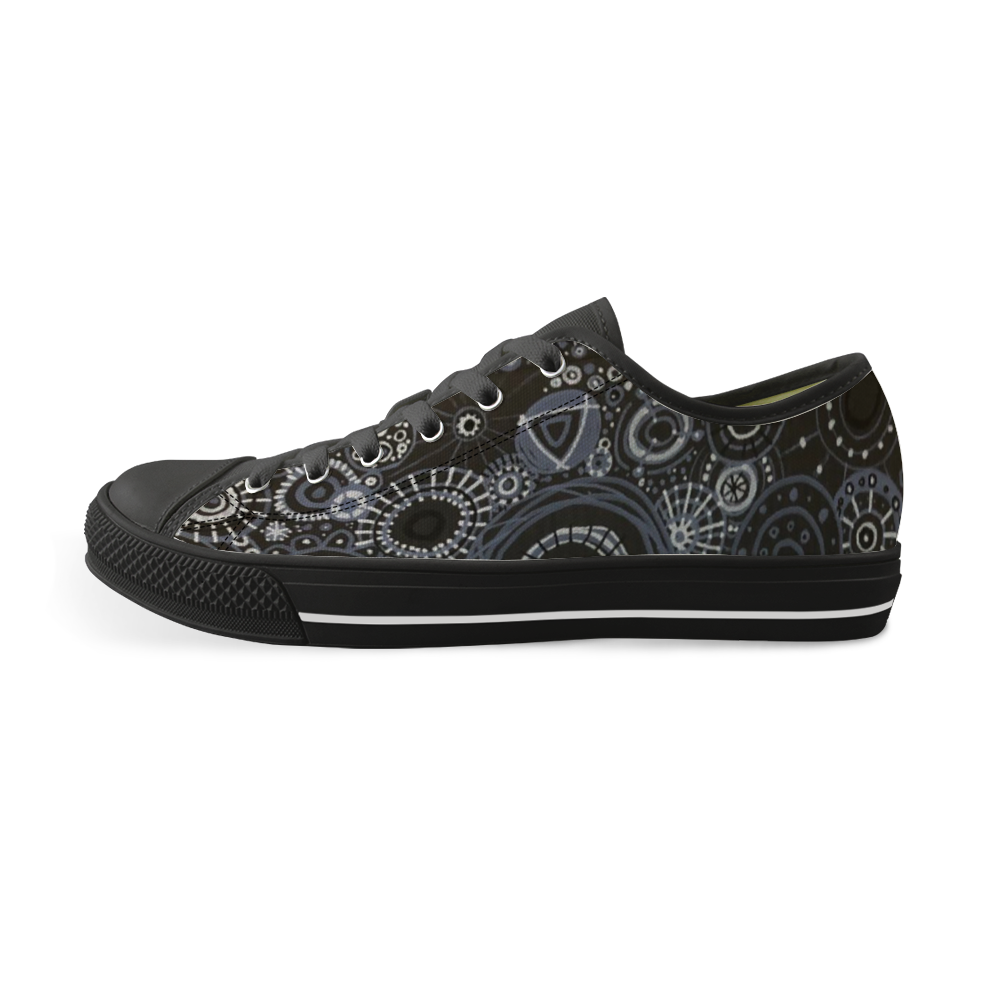 Sneakers with black features and all over pattern in greys and blacks. 