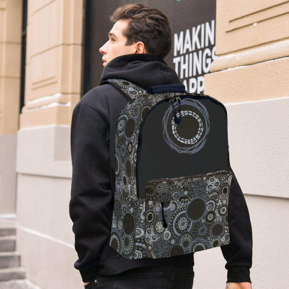 Sturdy backpack with many decorated panels with monotone design on model