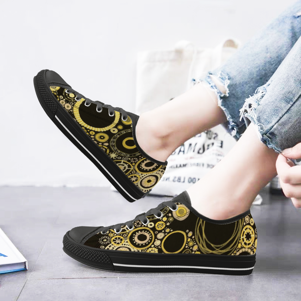 Sneakers with black features and sunshine and bumblebee tones on model