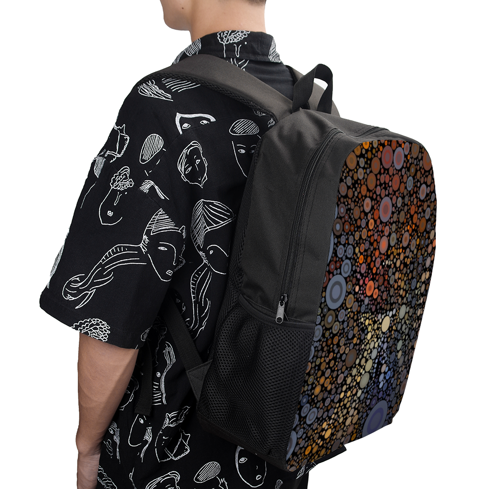 Medium size backpack with wild pattern of dots across the facing panel on model