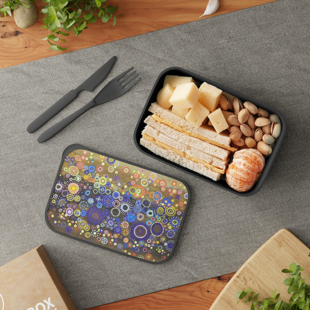 Bento lunch box with detailed joyous artwork on lid