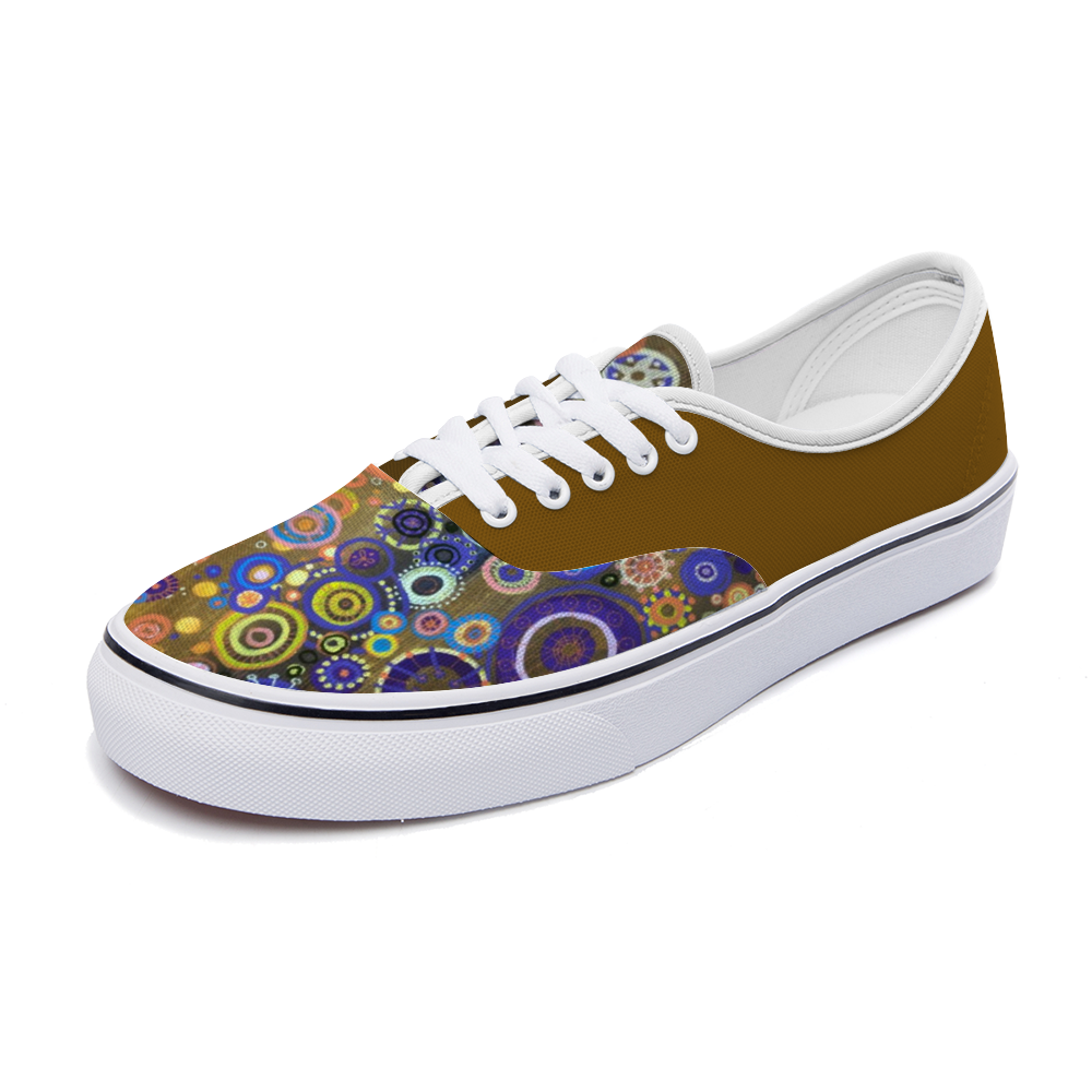 Sneakers with bright intricately coloured front and mustard dull back