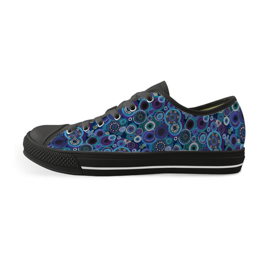 Sneakers with black features and painted with thosands of interlocking circles of purple and teal.