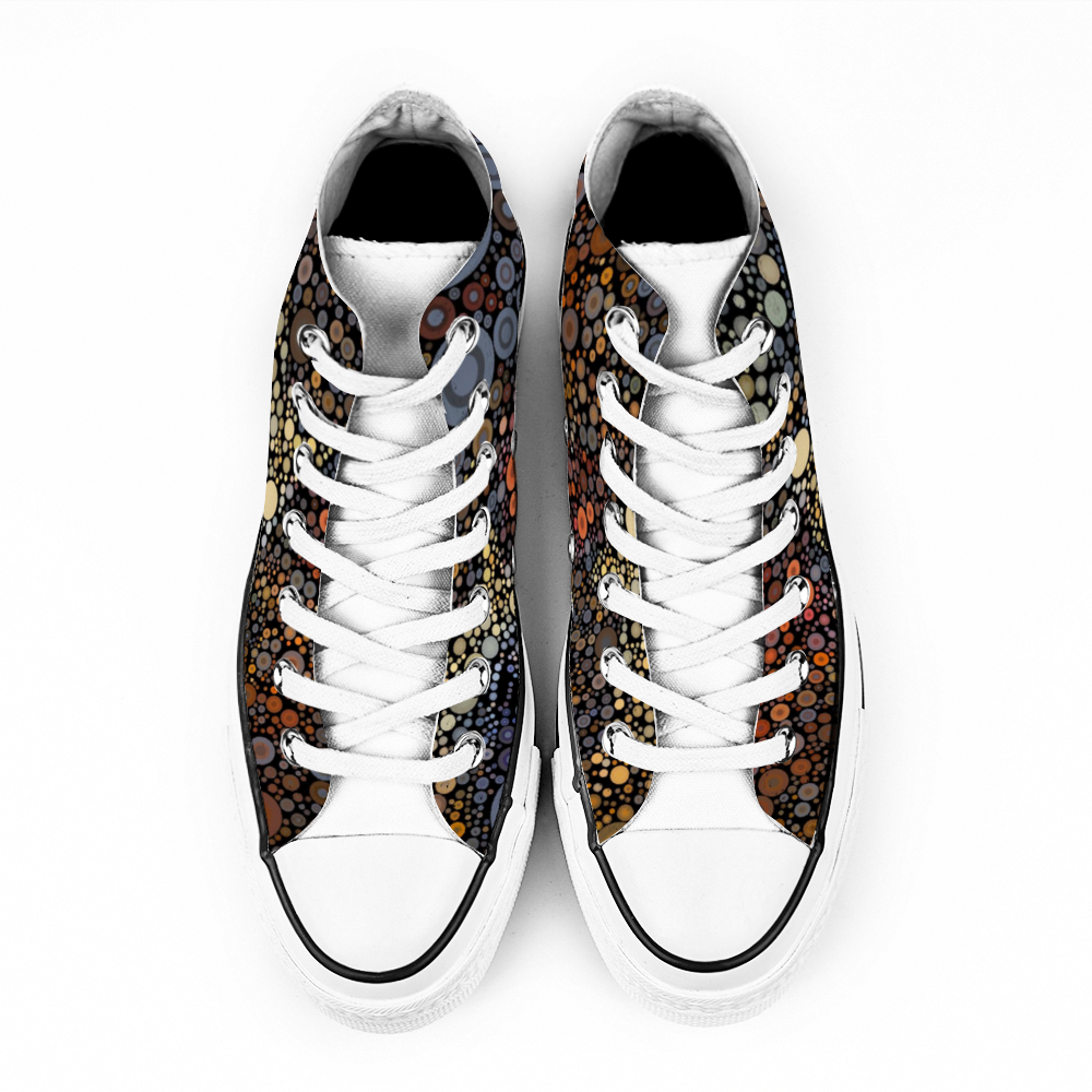 Top view shows white tongue, view Gymboot style canvas shoe, white sole and laces, an explosion of fiery dots on black background